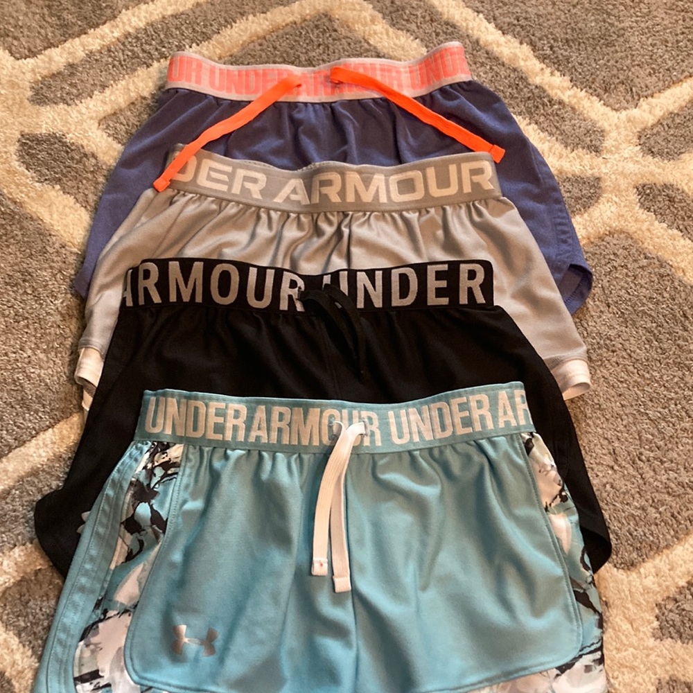 Girls M 4 pack Under Armor shorts